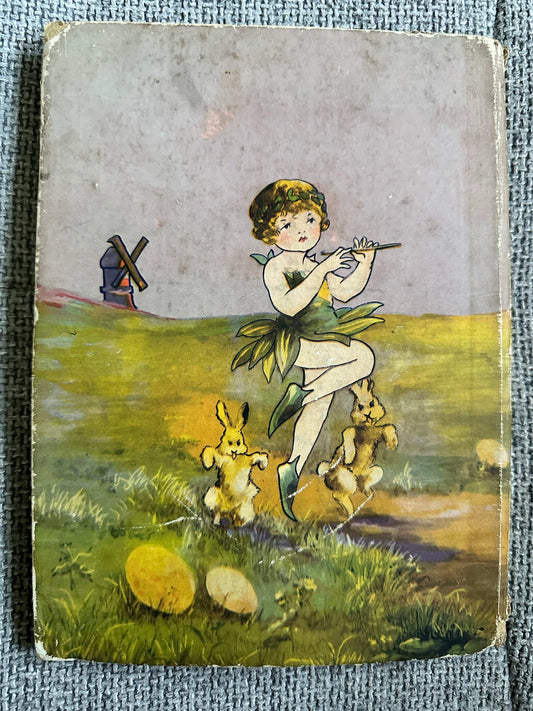 Cover of 1933 The Fairy Ring hardback featuring a girl playing a flute surrounded by rabbits