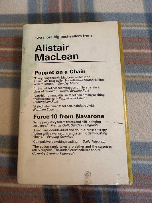 Back cover of 1970 Caravan to Vaccares Collins featuring Alistair MacLean's bestsellers and reviews.