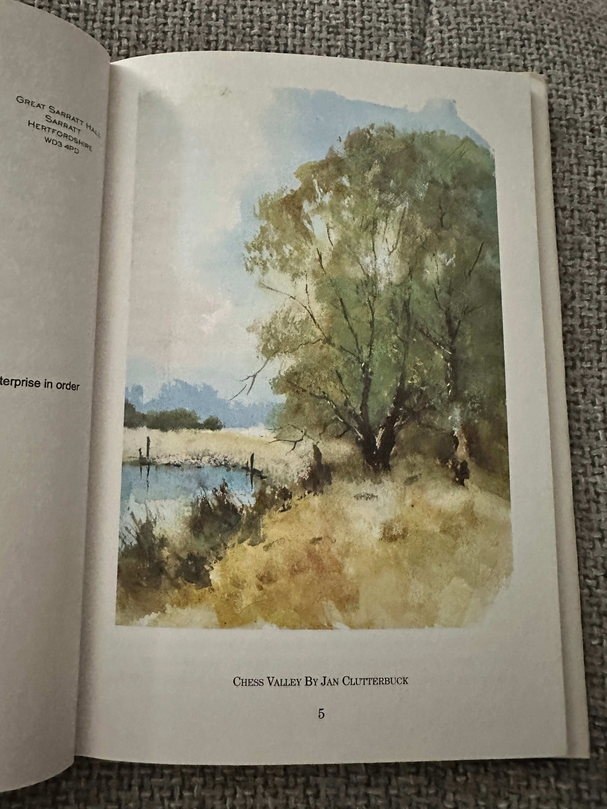 Page from the rare book 1999 Sarratt and the Draper of Watford featuring a watercolor painting of a serene landscape
