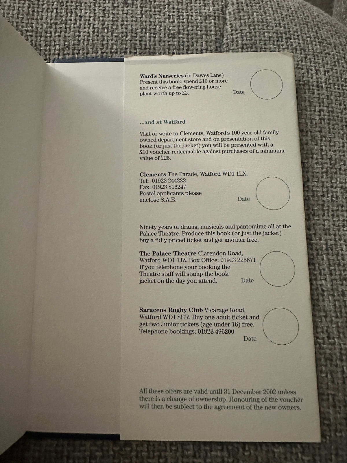 Inside page of 1999 Sarratt and the Draper of Watford rare book showing vouchers for local attractions
