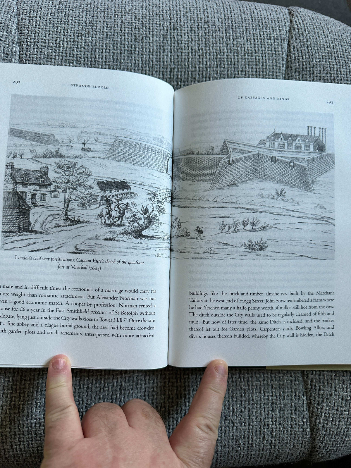 Open book showing illustrations in the Strange Blooms first edition for sale by Honeyburn Books