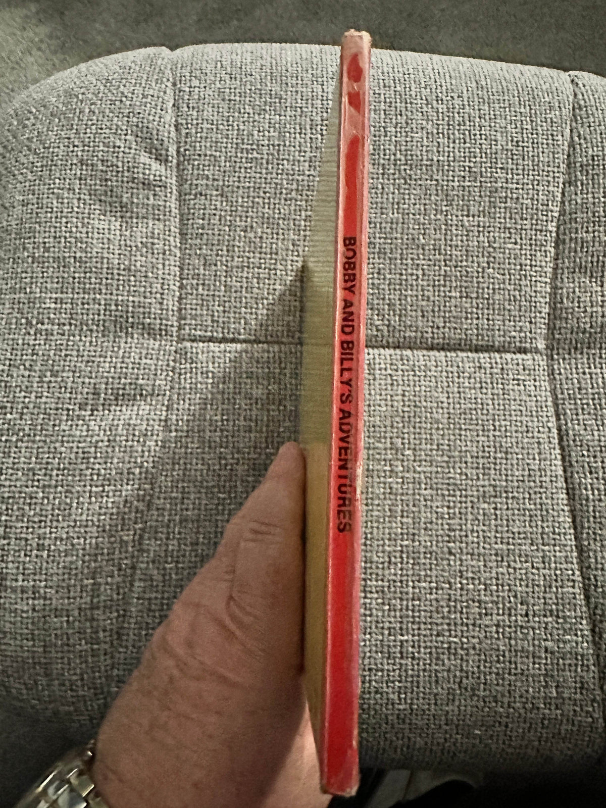Side view of the rare kids book titled Corrie Scherewitz rare kids book showing the spine and title of Bobby and Billy’s Adventures