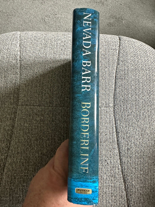Nevada Barr Borderline first edition book spine with blue design and bold text