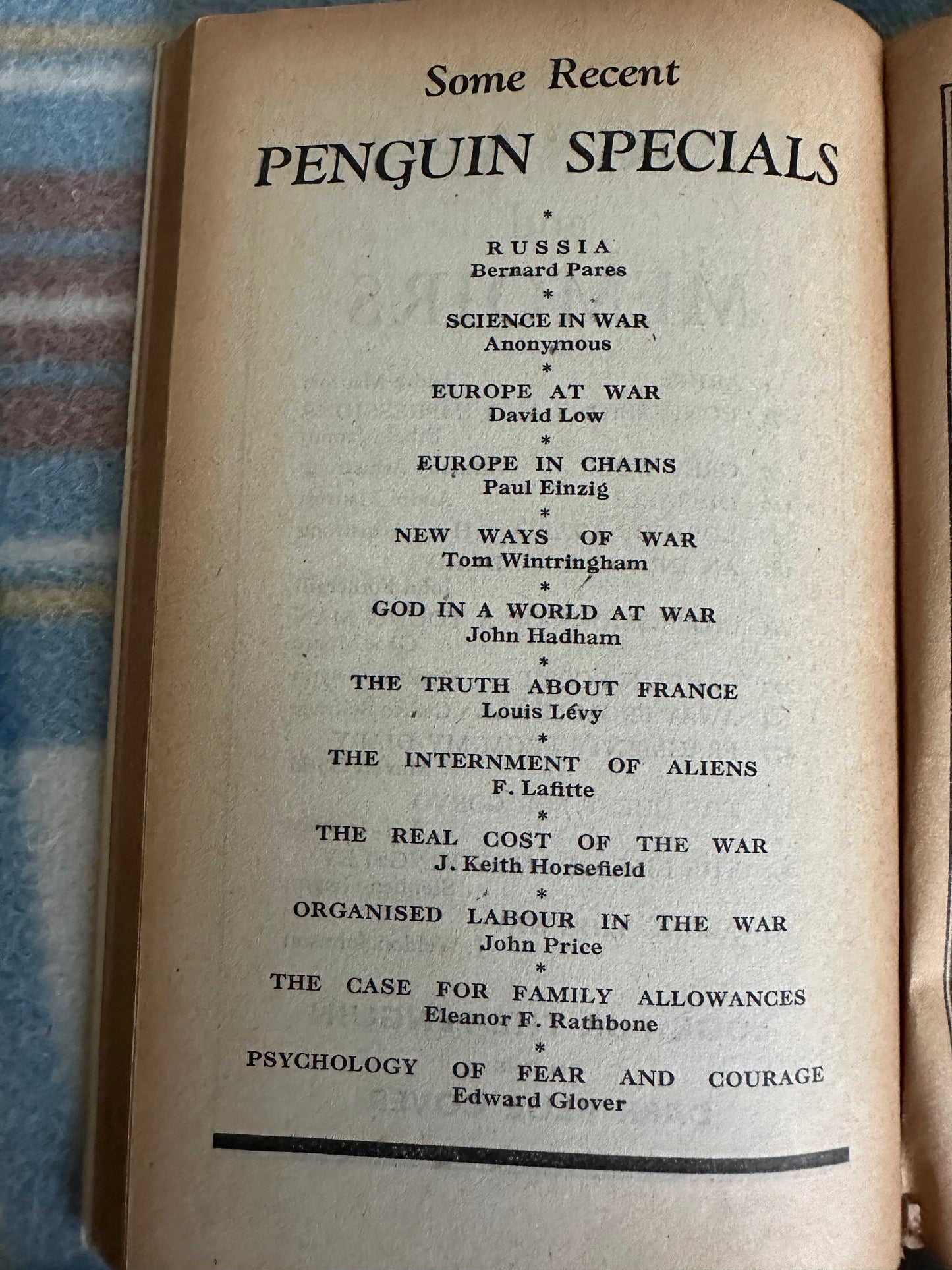 Page from a book showcasing Penguin Specials with titles including Sir Walter Ralegh biography first edition