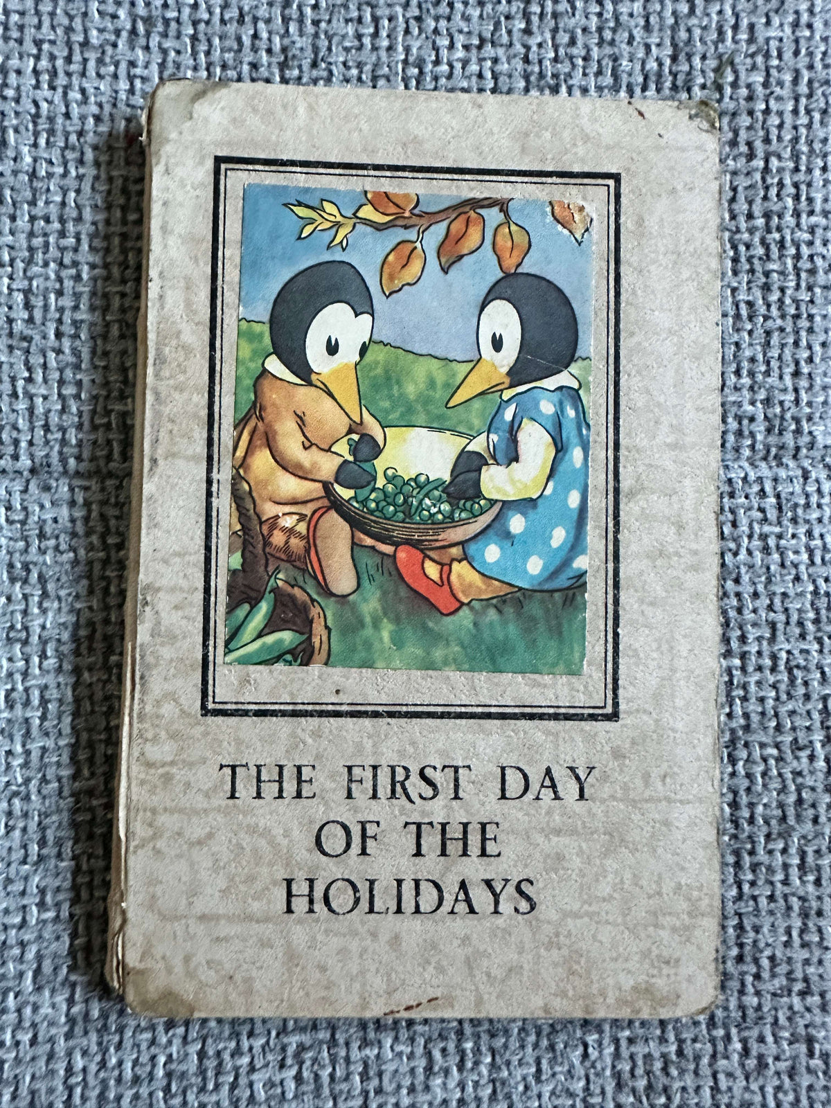 The First Day of the Holidays vintage children's book with charming penguin illustration on the cover