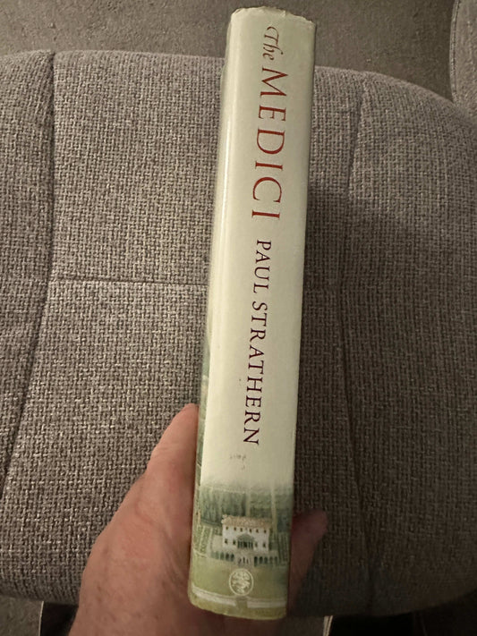 The Medici Godfathers of the Renaissance first edition by Paul Strathern showcased on a beige book spine