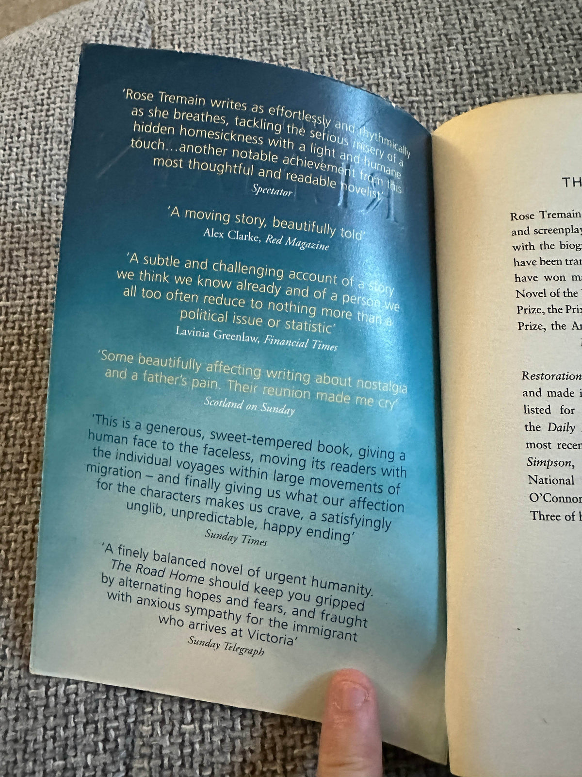 The Road Home Rose Tremain vintage book interior with positive reviews and quotes on a soft gradient background