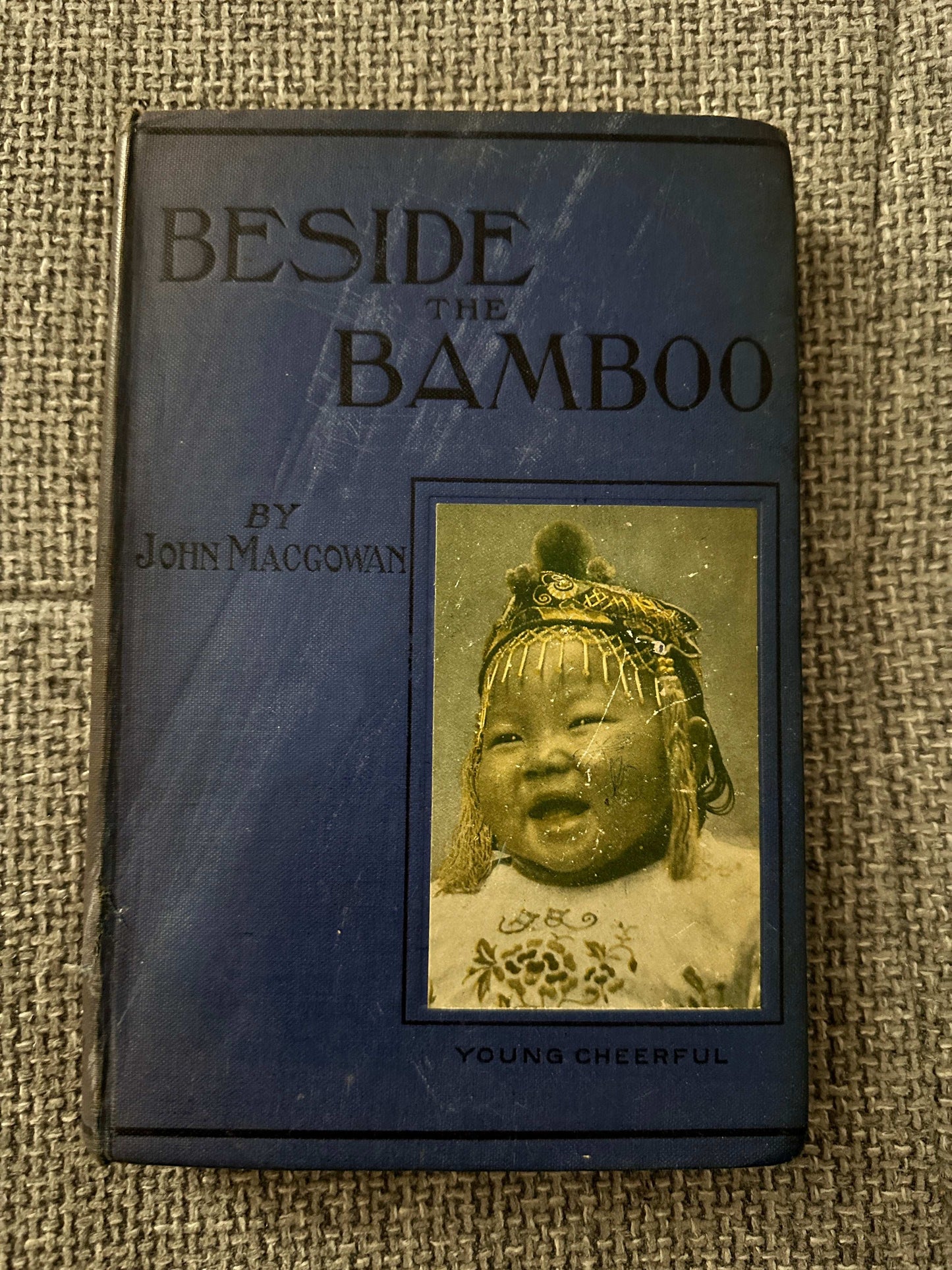 1914 Beside the Bamboo John MacGowan book cover featuring a young child in traditional attire