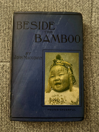 1914 Beside the Bamboo John MacGowan book cover featuring a young child in traditional attire