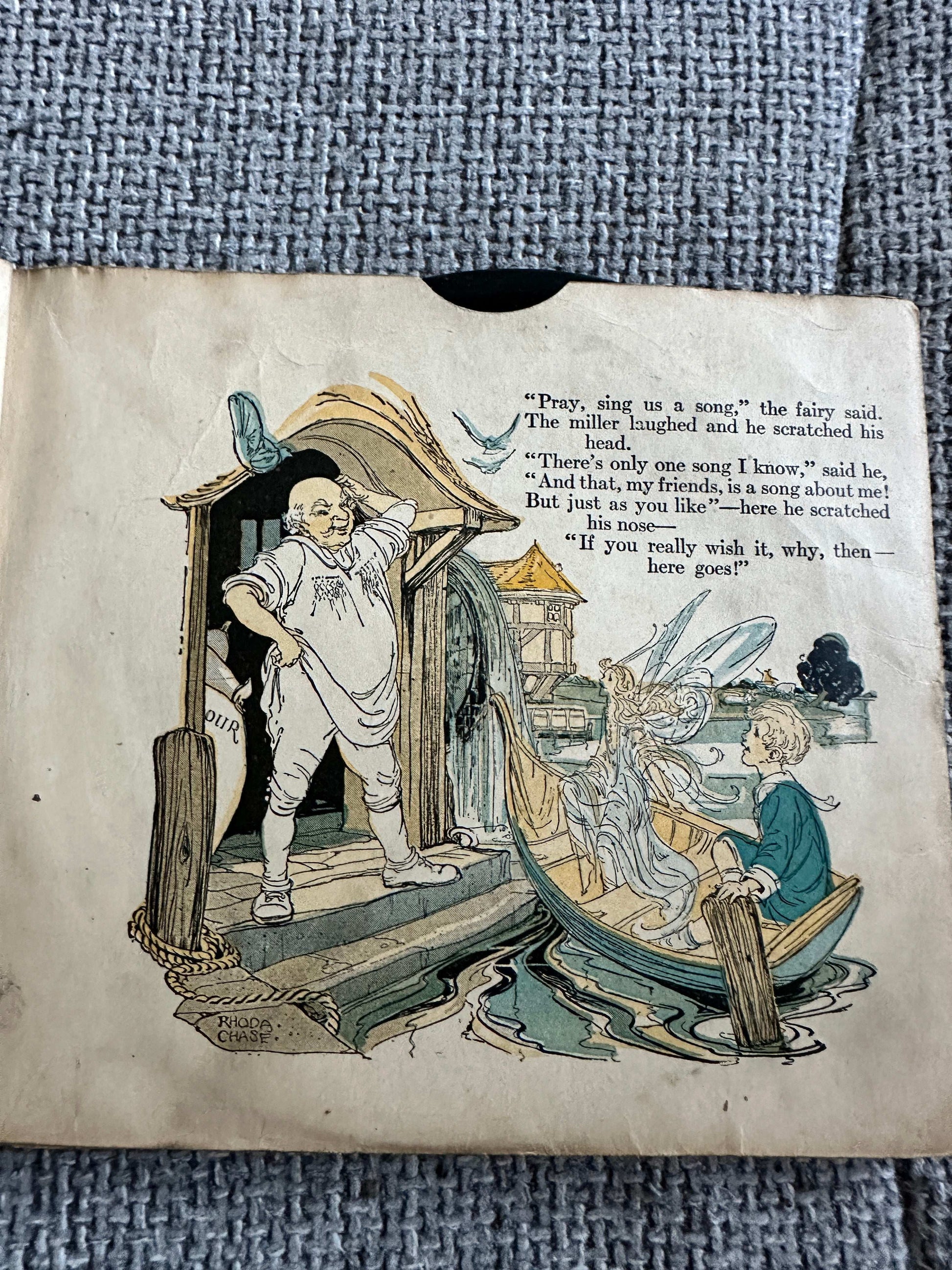 1917 Happy Go Lucky Bubble Book for sale featuring colorful illustrations of fairies and children in a whimsical scene
