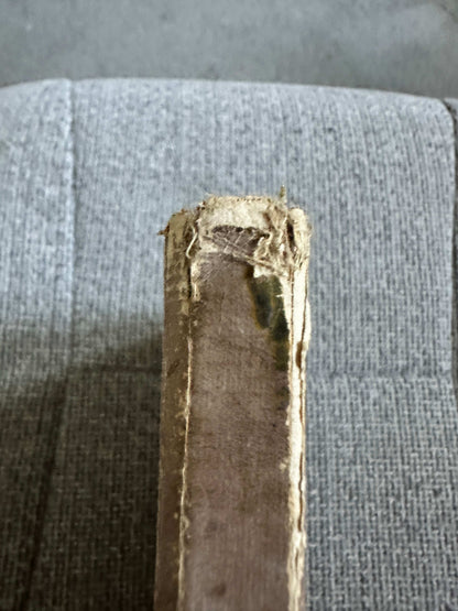 Spine view of 1933 The Fairy Ring hardback showing wear and tear on the edges