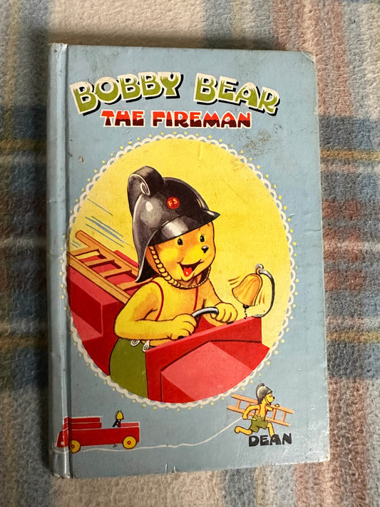 1959 Bobby Bear The Fireman book featuring a cheerful bear driving a fire truck