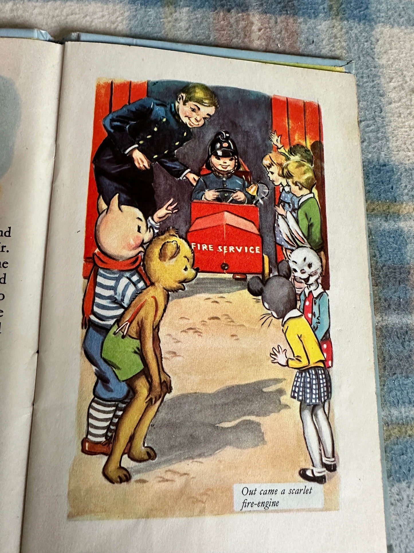 Illustration from the 1959 Bobby Bear The Fireman book featuring children and animals at a fire service scene