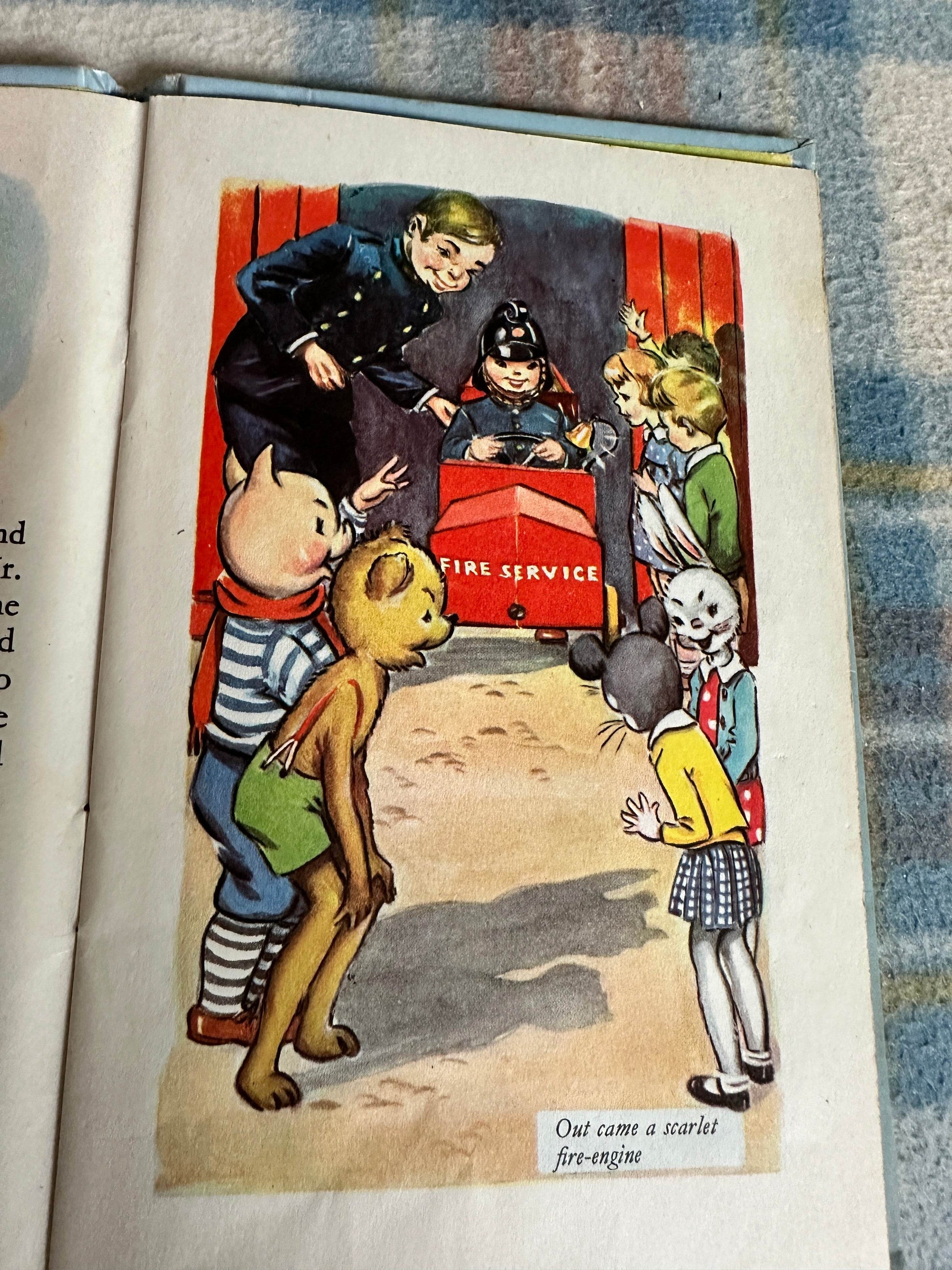 Illustration from the 1959 Bobby Bear The Fireman book featuring children and animals at a fire service scene