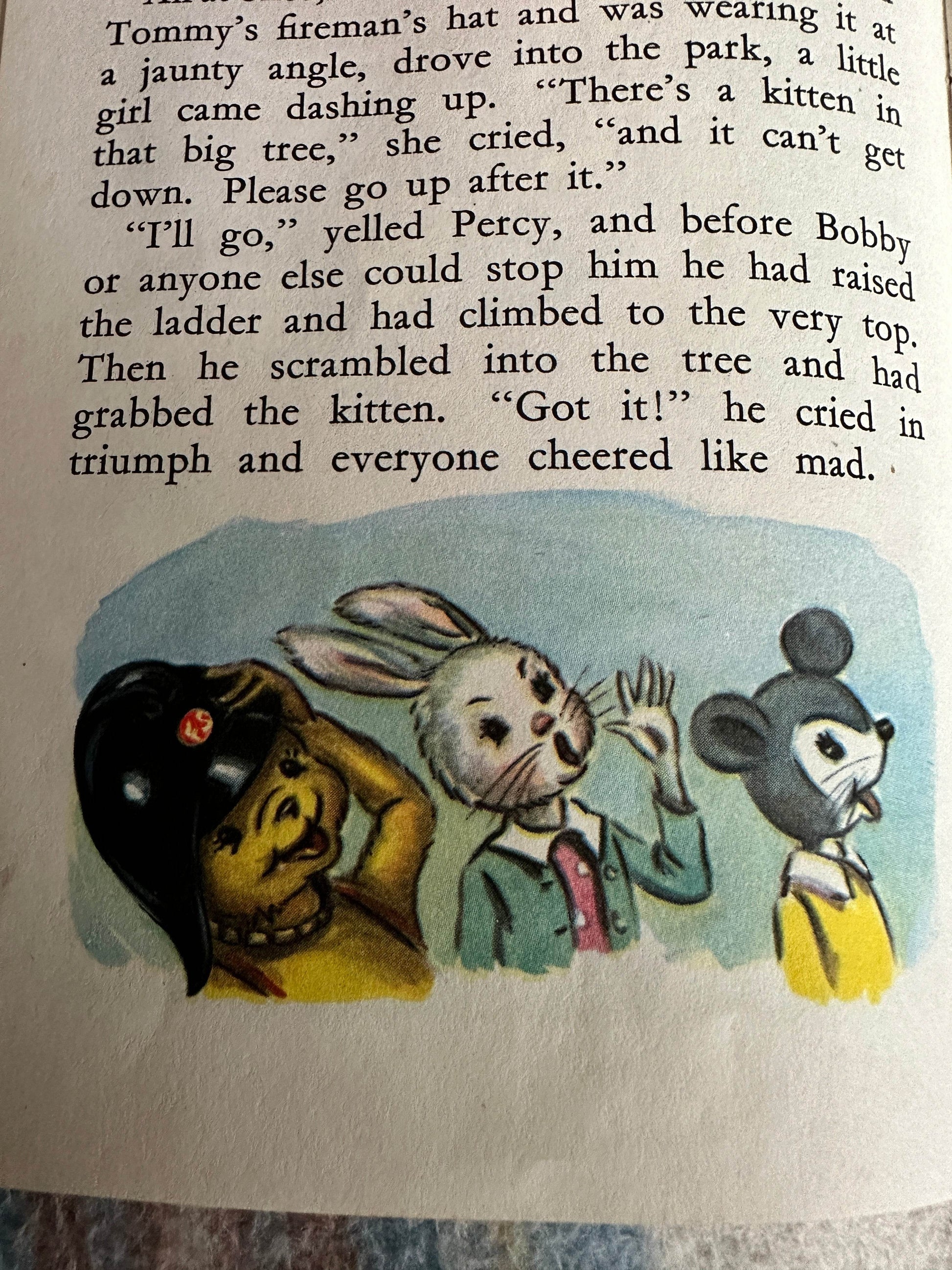 Illustration from 1959 Bobby Bear The Fireman book showing Bobby and friends rescuing a kitten from a tree