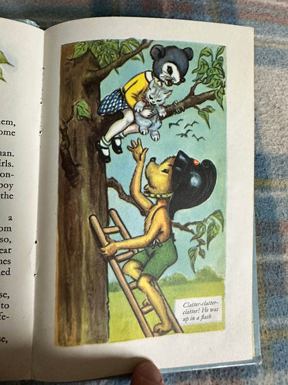 Vintage illustration from 1959 Bobby Bear The Fireman book showing a bear rescuing a cat from a tree