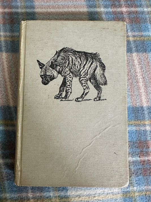 1960 Animals of East Africa book cover featuring an illustrated hyena design.