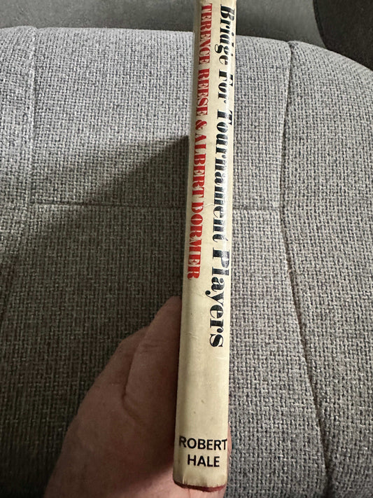 1969 Bridge For Tournament Players book by Terence Reese and Albert Dormer displayed on a cozy background