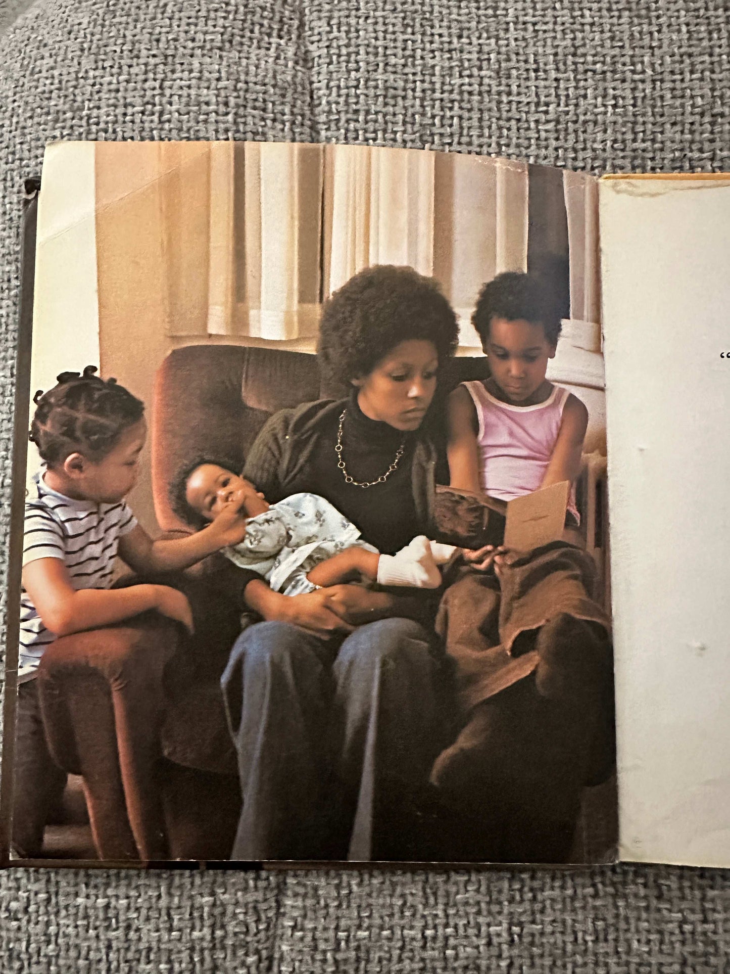 1978 Hamish Hamilton collectible book featuring a mother reading to her children in a cozy setting