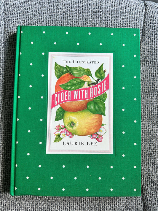 1984 Cider With Rosie illustrated edition featuring a green cover with apples and floral designs