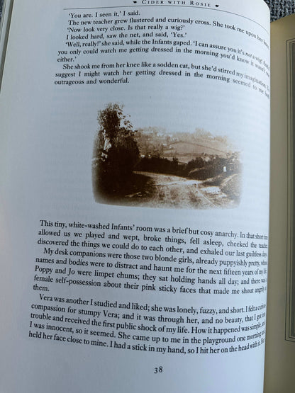 Page from 1984 Cider With Rosie illustrated edition showing text and vintage illustration of a rural scene