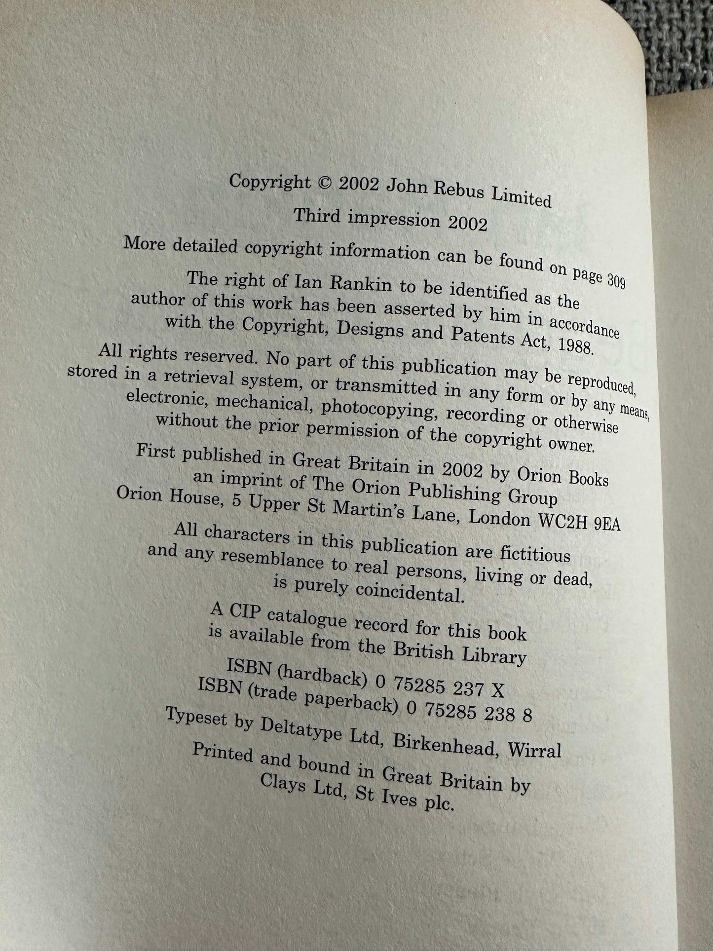 2002 signed Ian Rankin Beggars Banquet book page showing copyright information and printing details