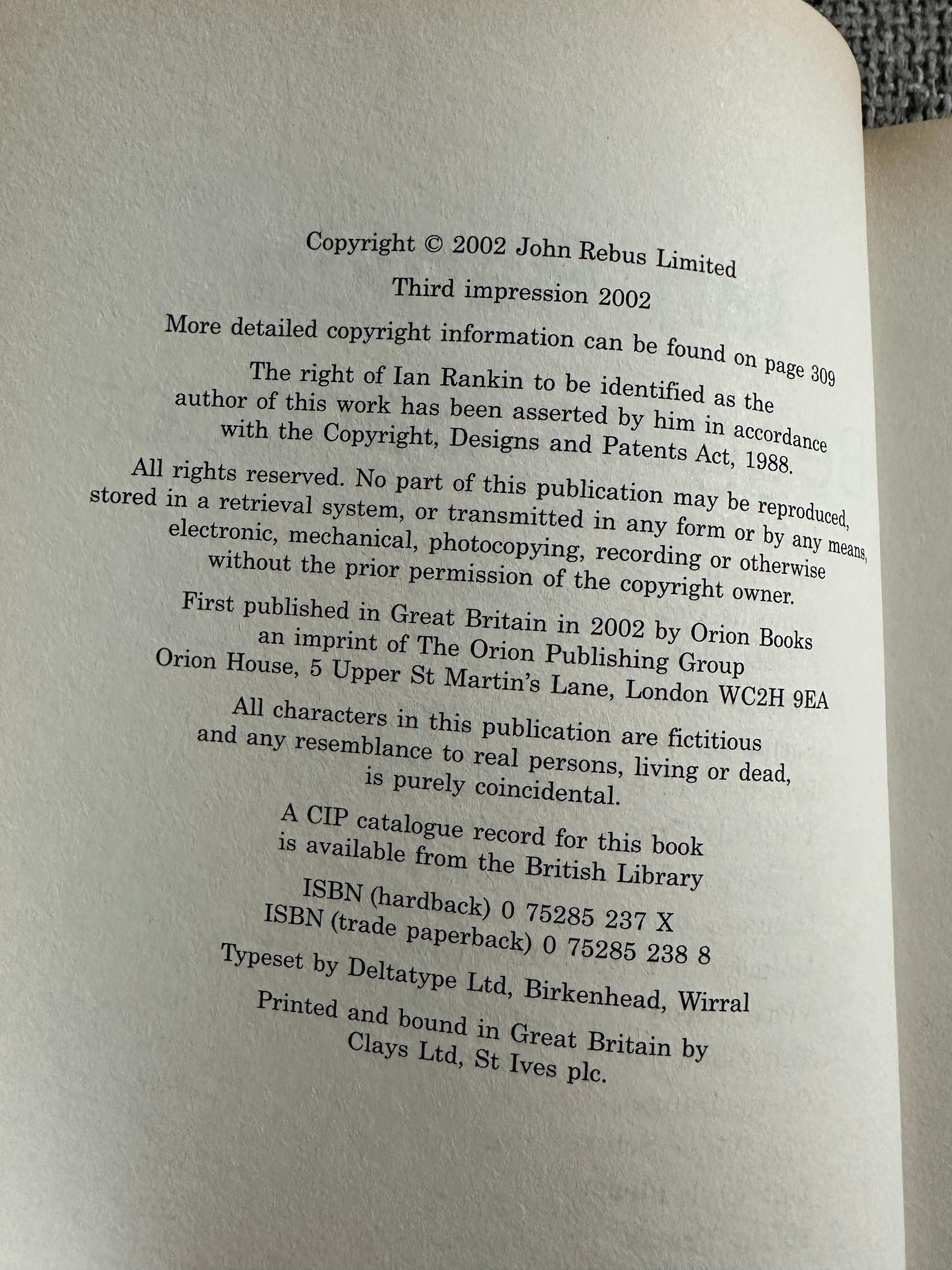 2002 signed Ian Rankin Beggars Banquet book page showing copyright information and printing details