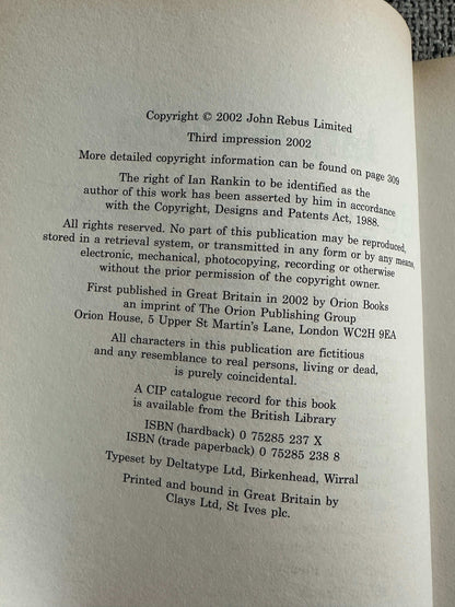 2002 signed Ian Rankin Beggars Banquet book page showing copyright information and printing details