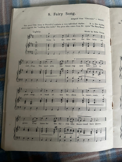 Page from A First Garland of Great Tunes Percy M Young showing sheet music with lyrics and notes