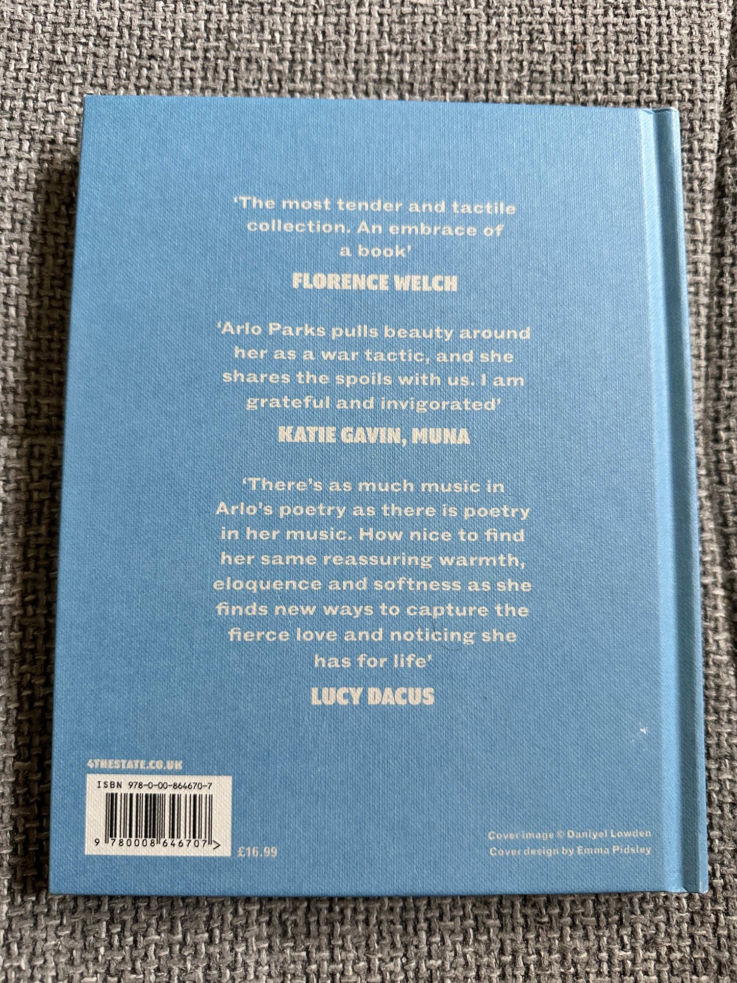 The Magic Border signed poetry book featuring quotes from Florence Welch and Lucy Dacus on its back cover