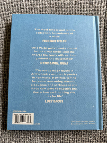 The Magic Border signed poetry book featuring quotes from Florence Welch and Lucy Dacus on its back cover