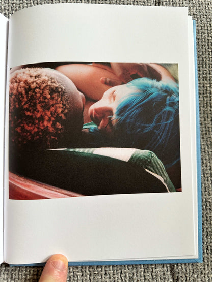 A tender moment captured within The Magic Border signed poetry book showcasing intimate imagery