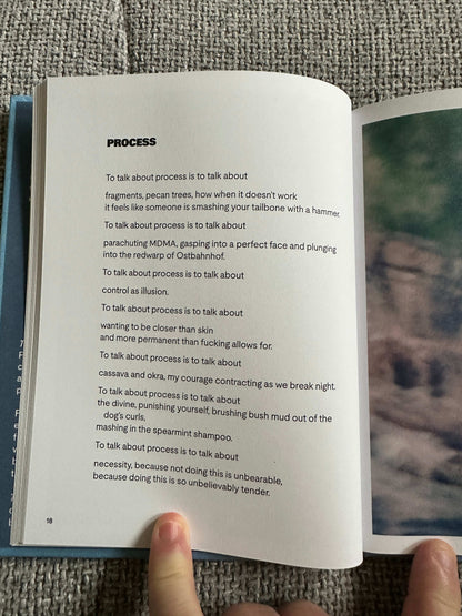The Magic Border signed poetry book open to a page discussing the creative process with handwritten notes