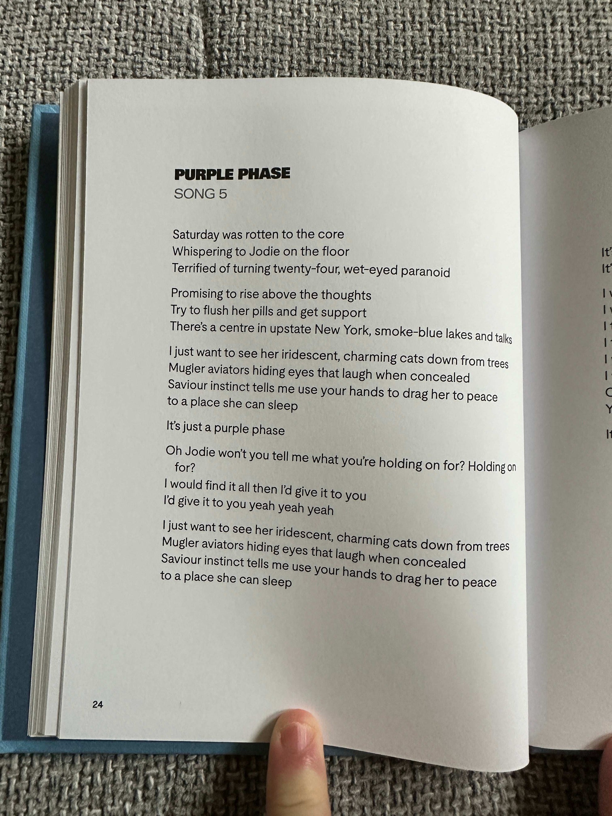 Page from The Magic Border signed poetry book featuring the poem Purple Phase with unique imagery
