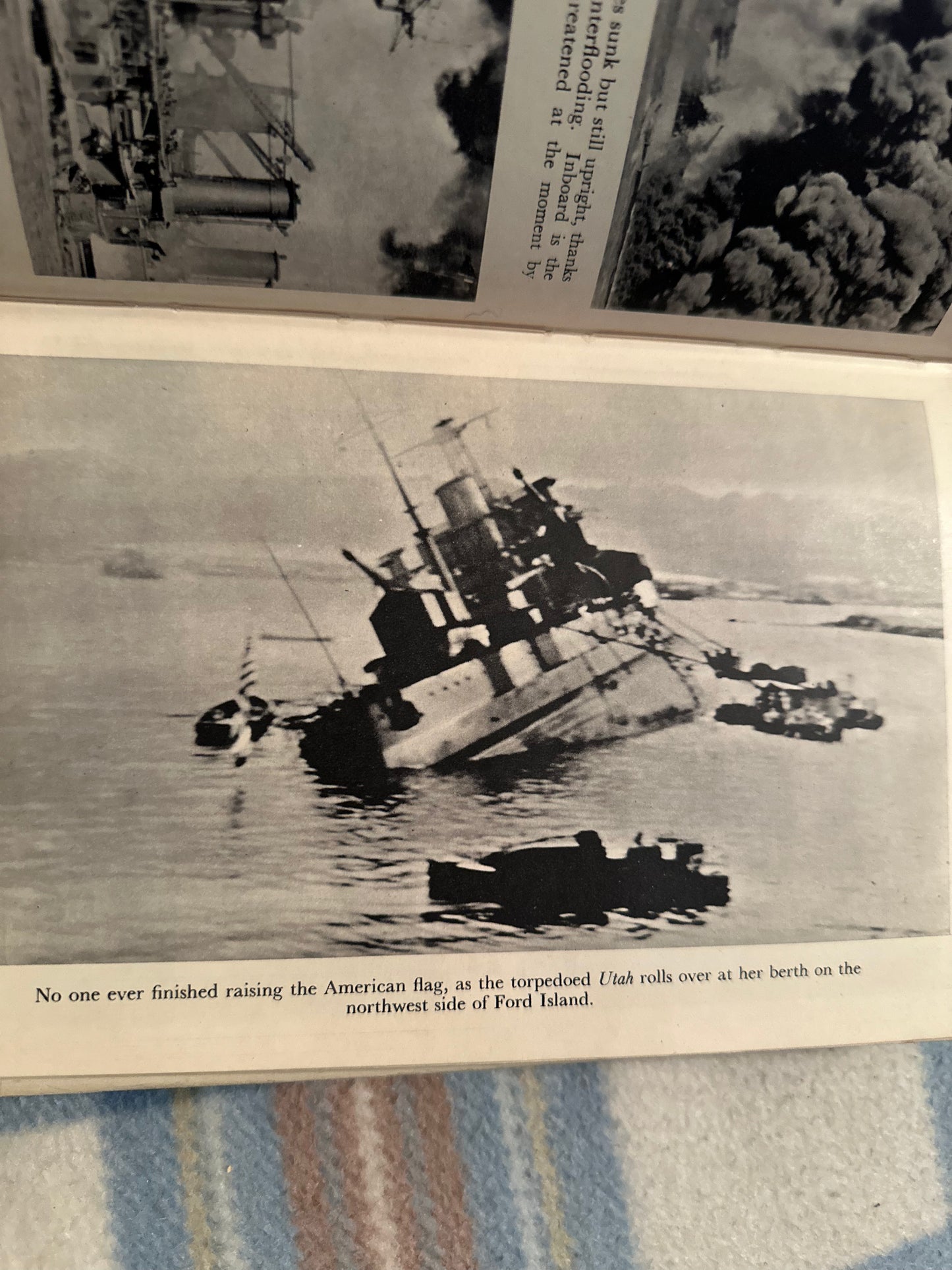 Day of Infamy first edition book page featuring a historic black and white image of a sinking ship.