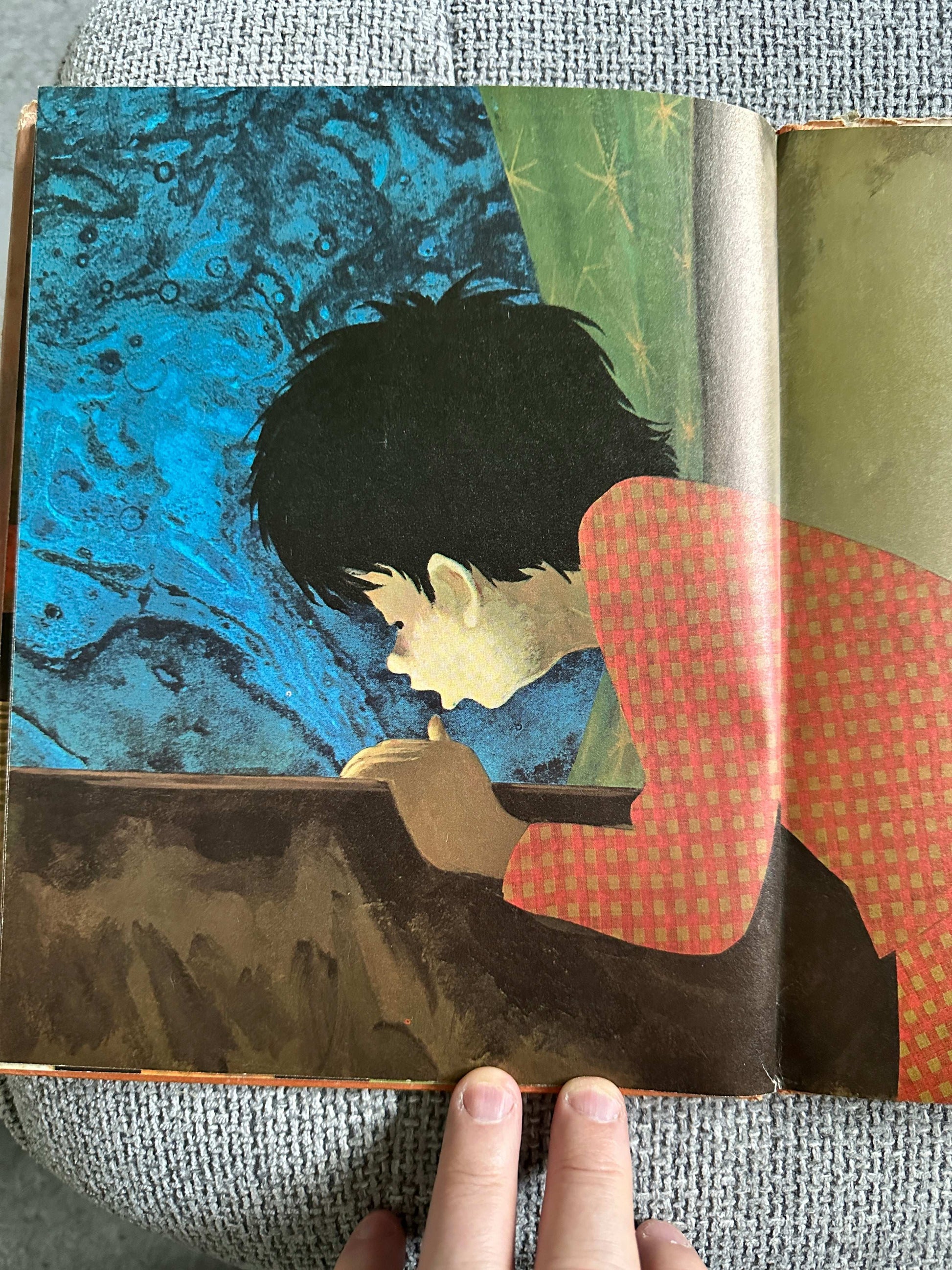 Inside illustration from Dreams Ezra Jack Keats first edition showing a child captivated by a colorful background