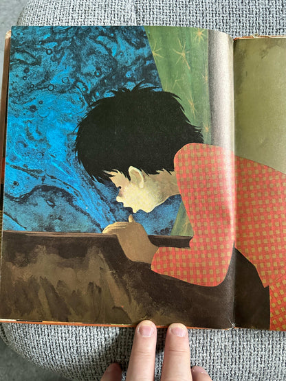 Inside illustration from Dreams Ezra Jack Keats first edition showing a child captivated by a colorful background