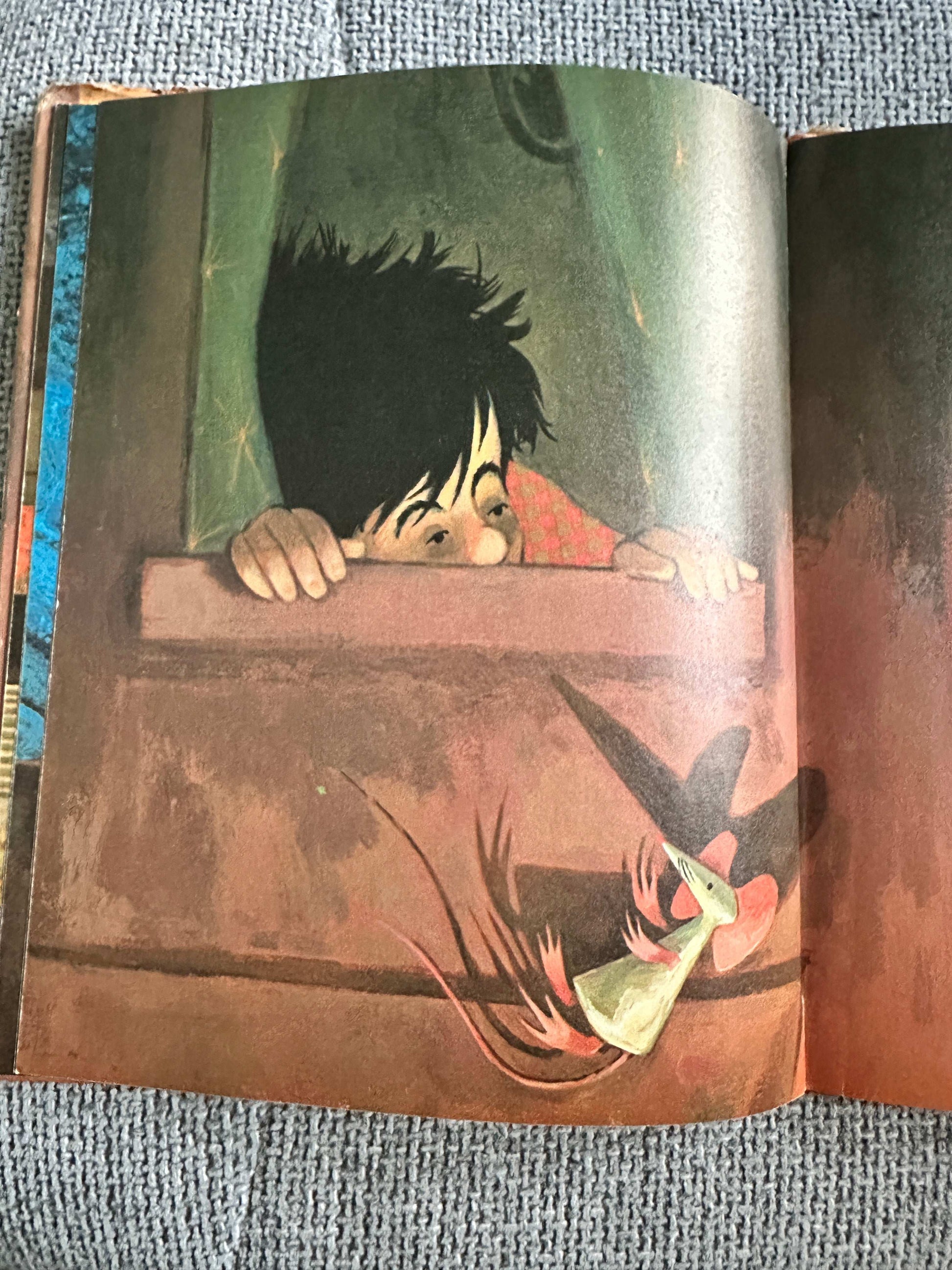 Dreams Ezra Jack Keats first edition illustrated page showing a child peeking out of a window