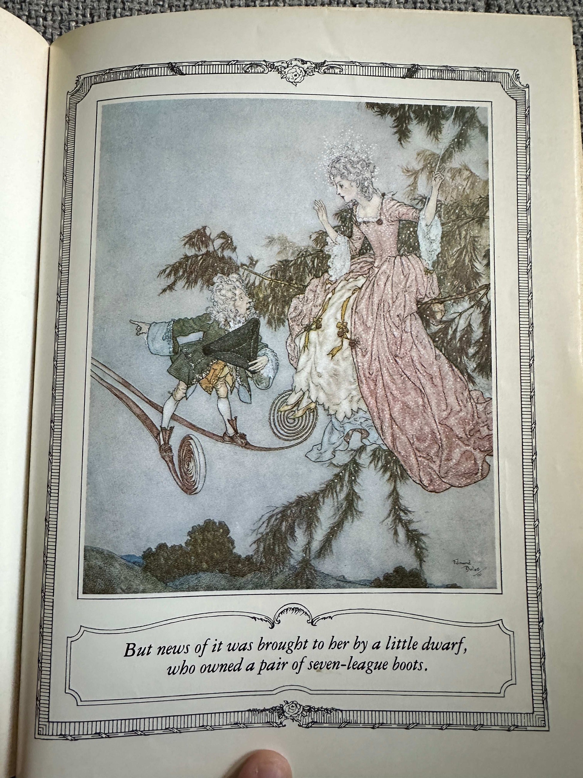 Edmund Dulac illustrated fairytales page showing a dwarf and a lady in a whimsical landscape