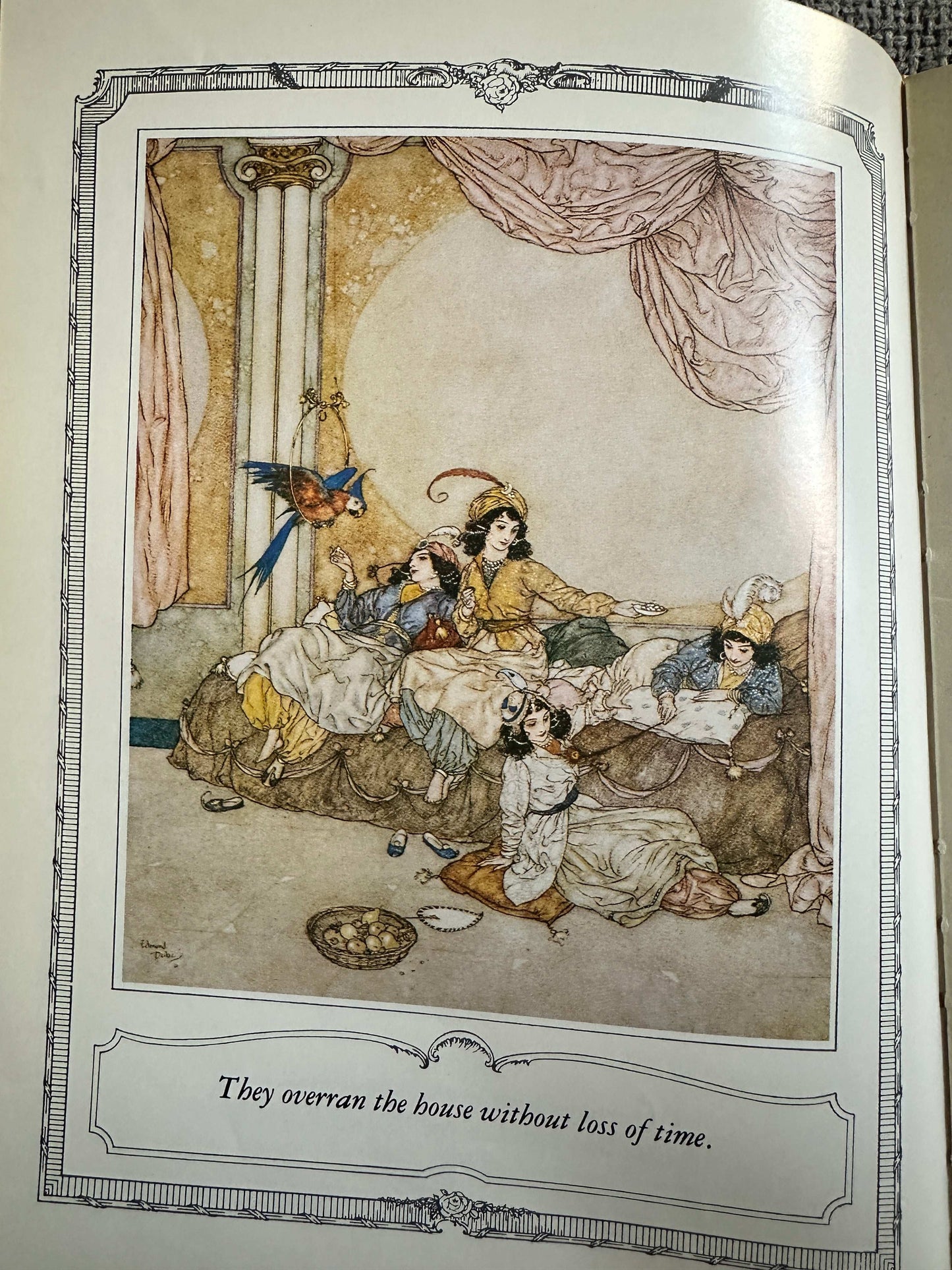 Edmund Dulac illustrated fairytales book page featuring a whimsical scene with children and characters