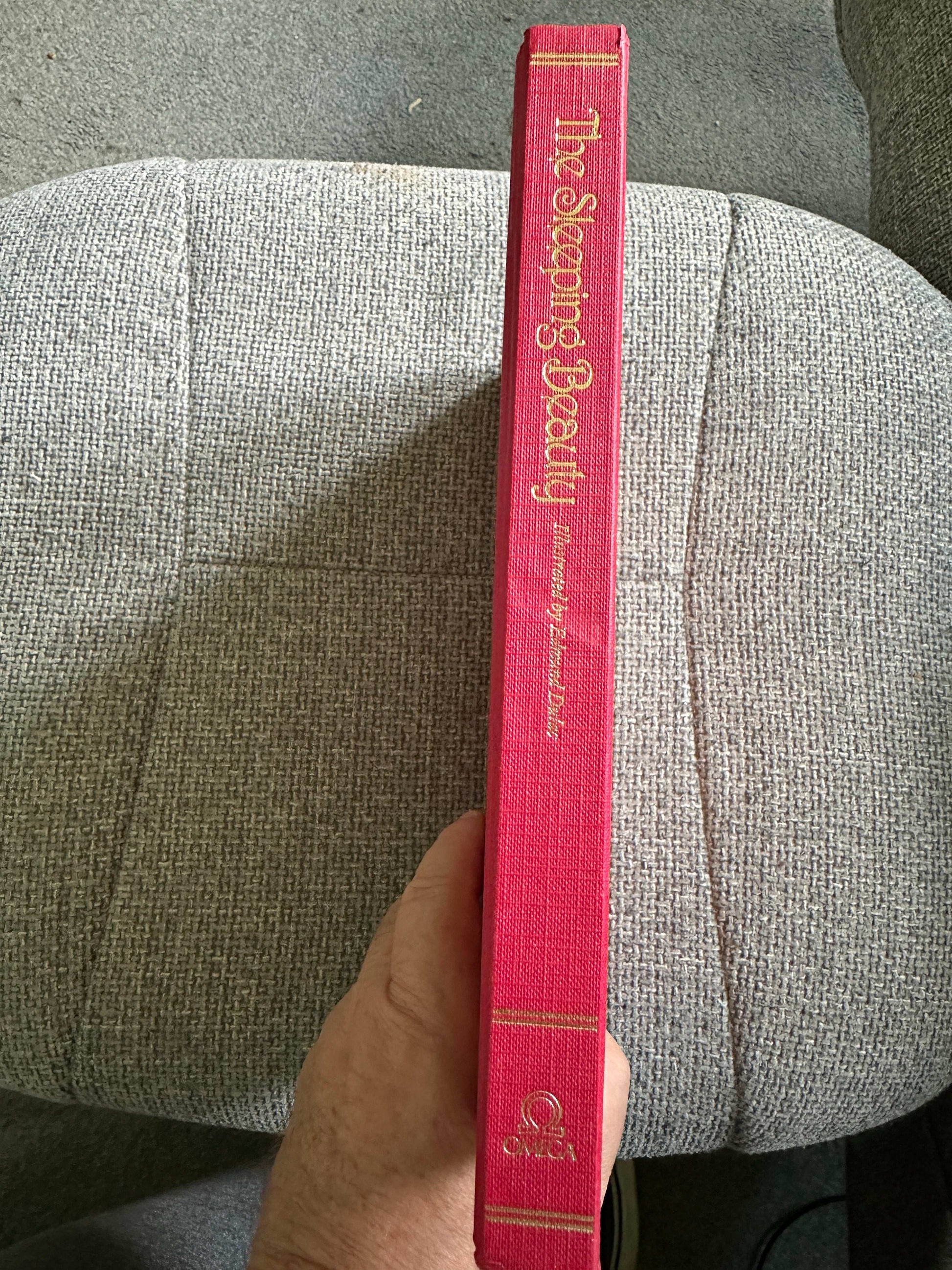 The Stepping Beauty book with a vibrant red cover featuring Edmund Dulac illustrated fairytales