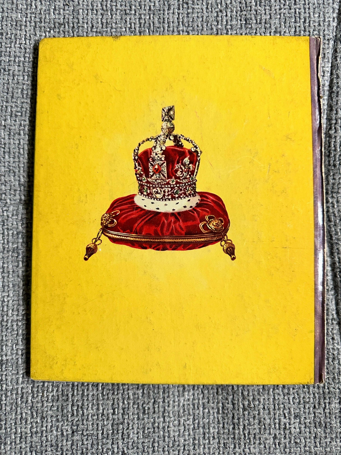 Enid Blyton The Story Of Our Queen first edition book cover featuring a royal crown on a yellow background