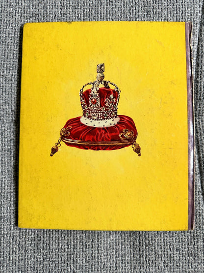 Enid Blyton The Story Of Our Queen first edition book cover featuring a royal crown on a yellow background