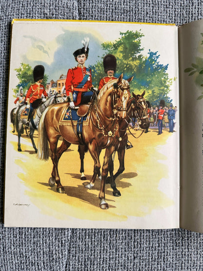 Illustration from Enid Blyton The Story Of Our Queen first edition showing mounted royal guards in vibrant uniforms