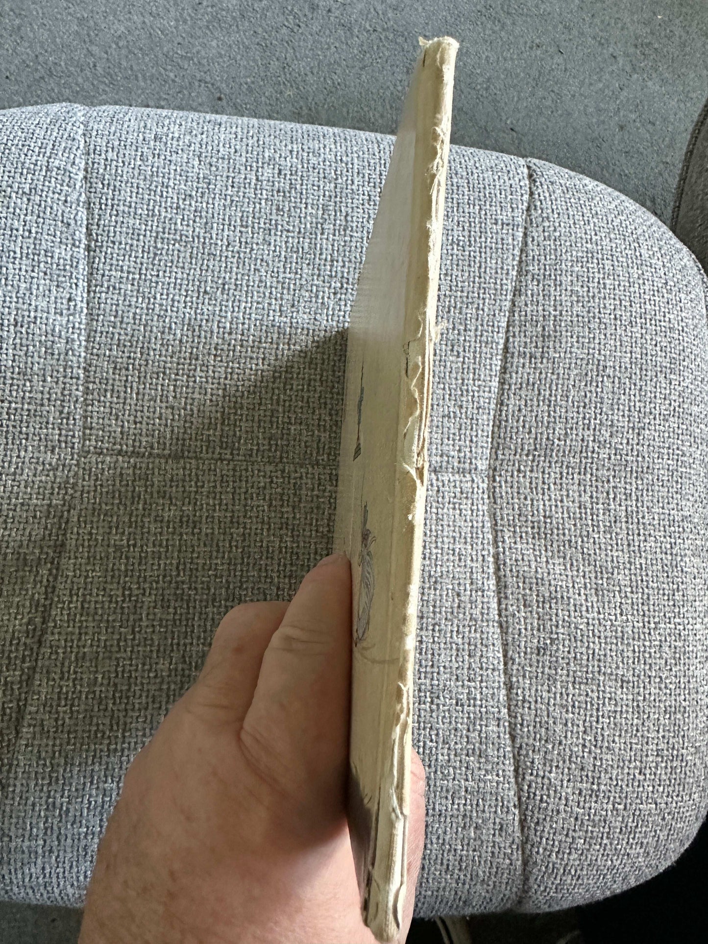 Side view of Enid Blyton The Twins Go To Nursery-Rhyme Land first edition book with worn cover