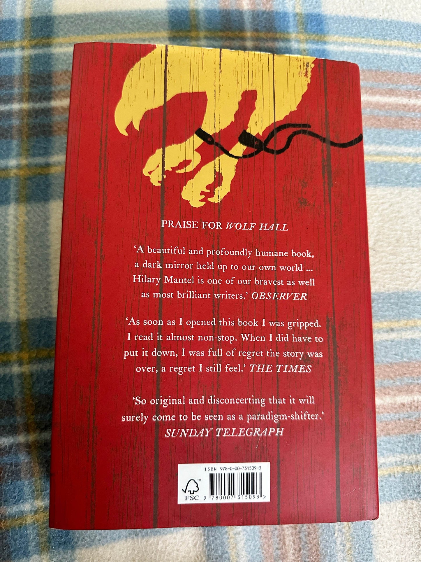 Back cover of first edition Bring Up The Bodies Hilary Mantel with praise and red design