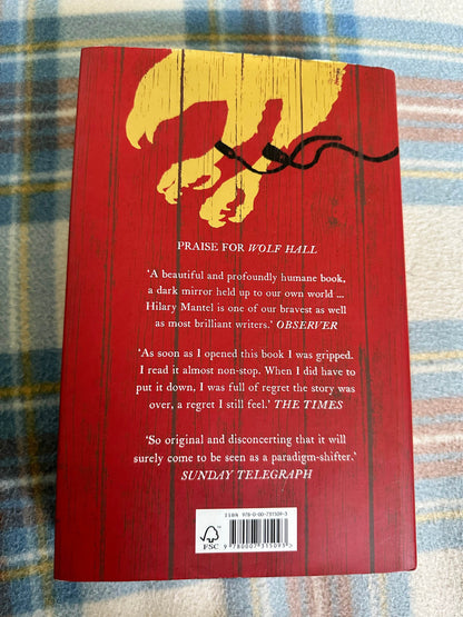 Back cover of first edition Bring Up The Bodies Hilary Mantel with praise and red design