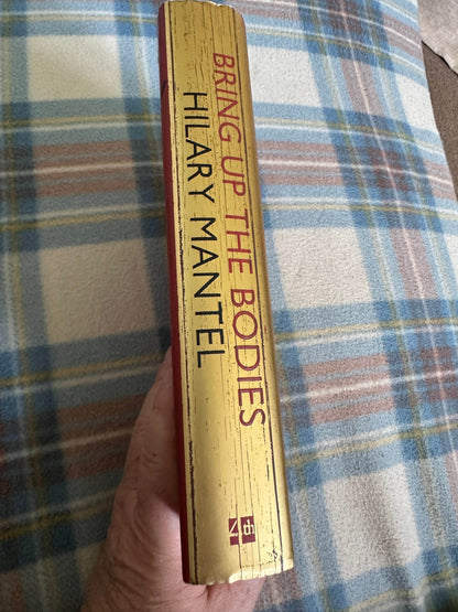First edition Bring Up The Bodies Hilary Mantel book spine with gold lettering and textured finish