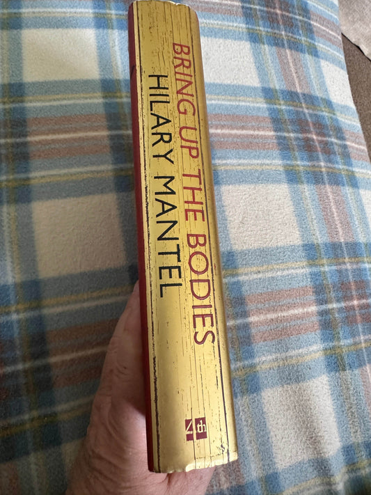 First edition Bring Up The Bodies Hilary Mantel book spine with gold lettering and textured finish