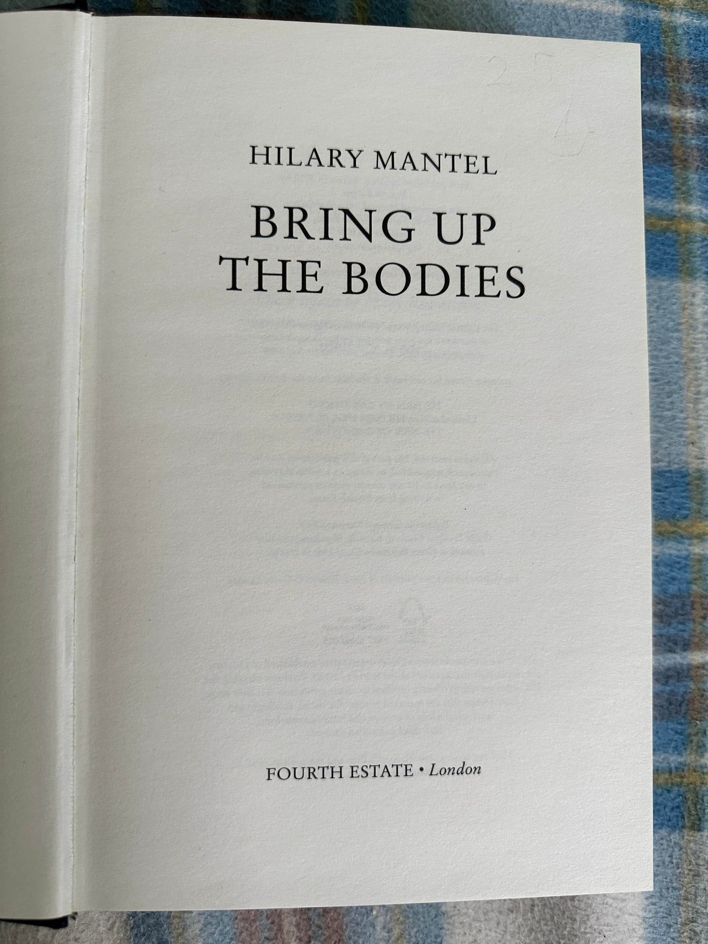 First edition Bring Up The Bodies Hilary Mantel title page on a patterned background